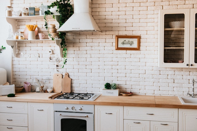 kitchen counter with brick blacksplash